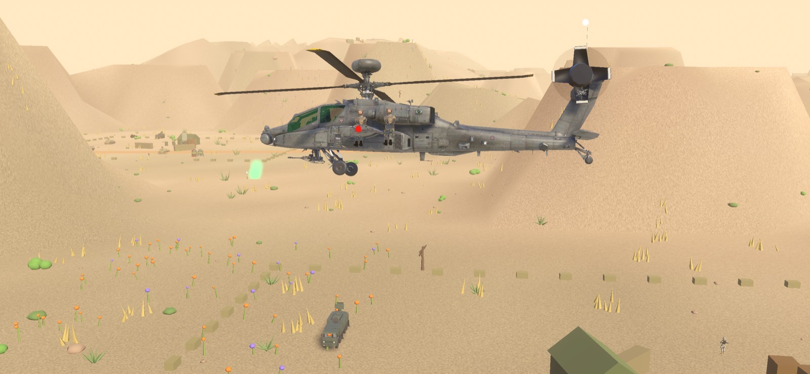An Apache in gunship grey holding over open desert with an armoured vehicle below